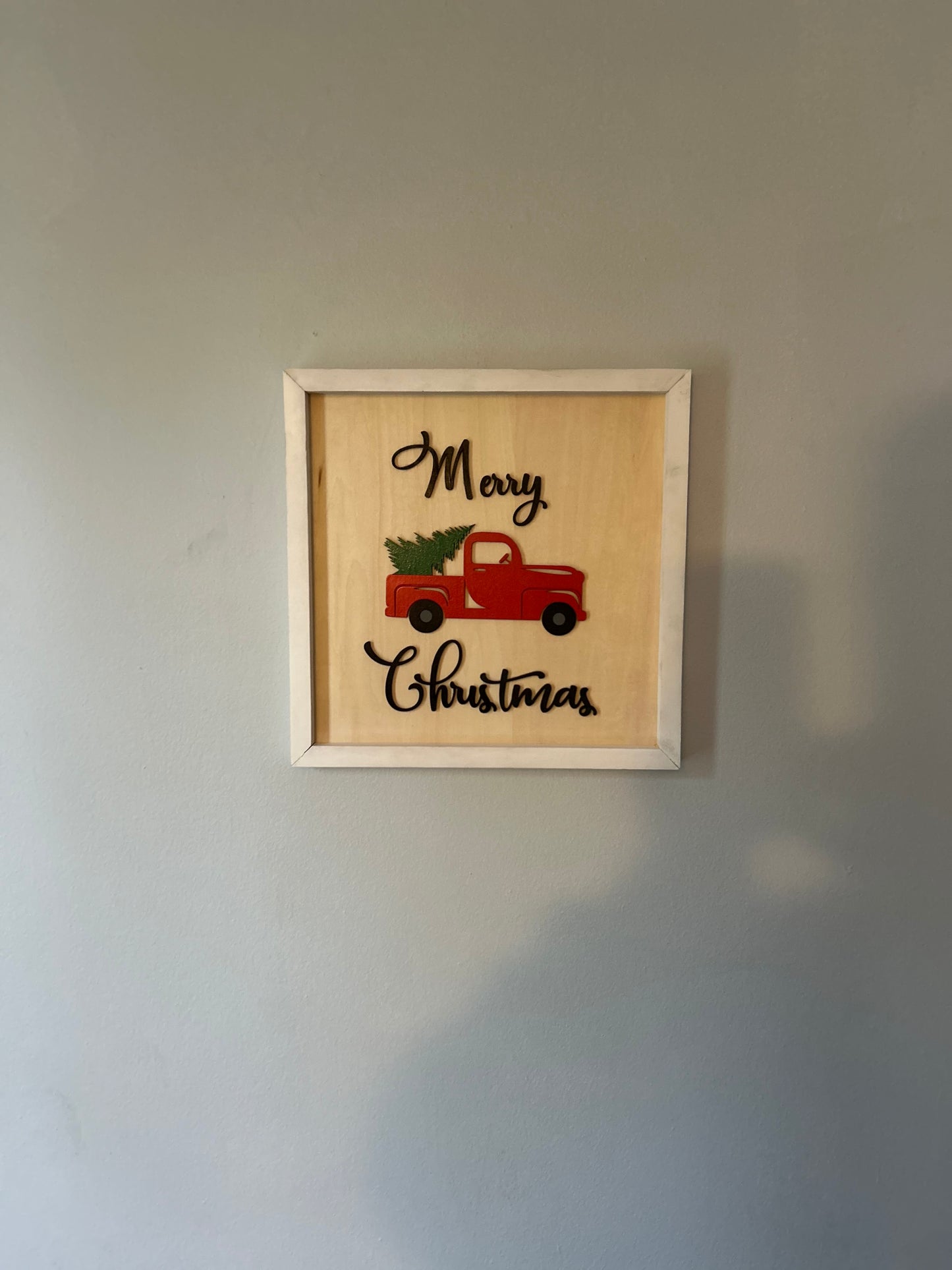 Red truck merry Christmas sign